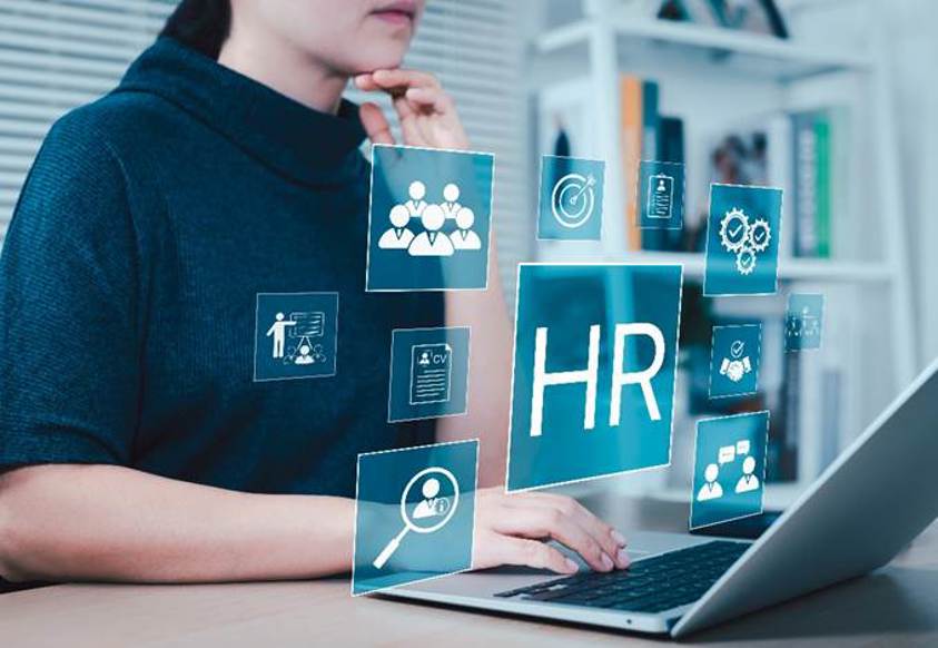 A person sitting at a desk using a computer

AI-generated content may be incorrect.